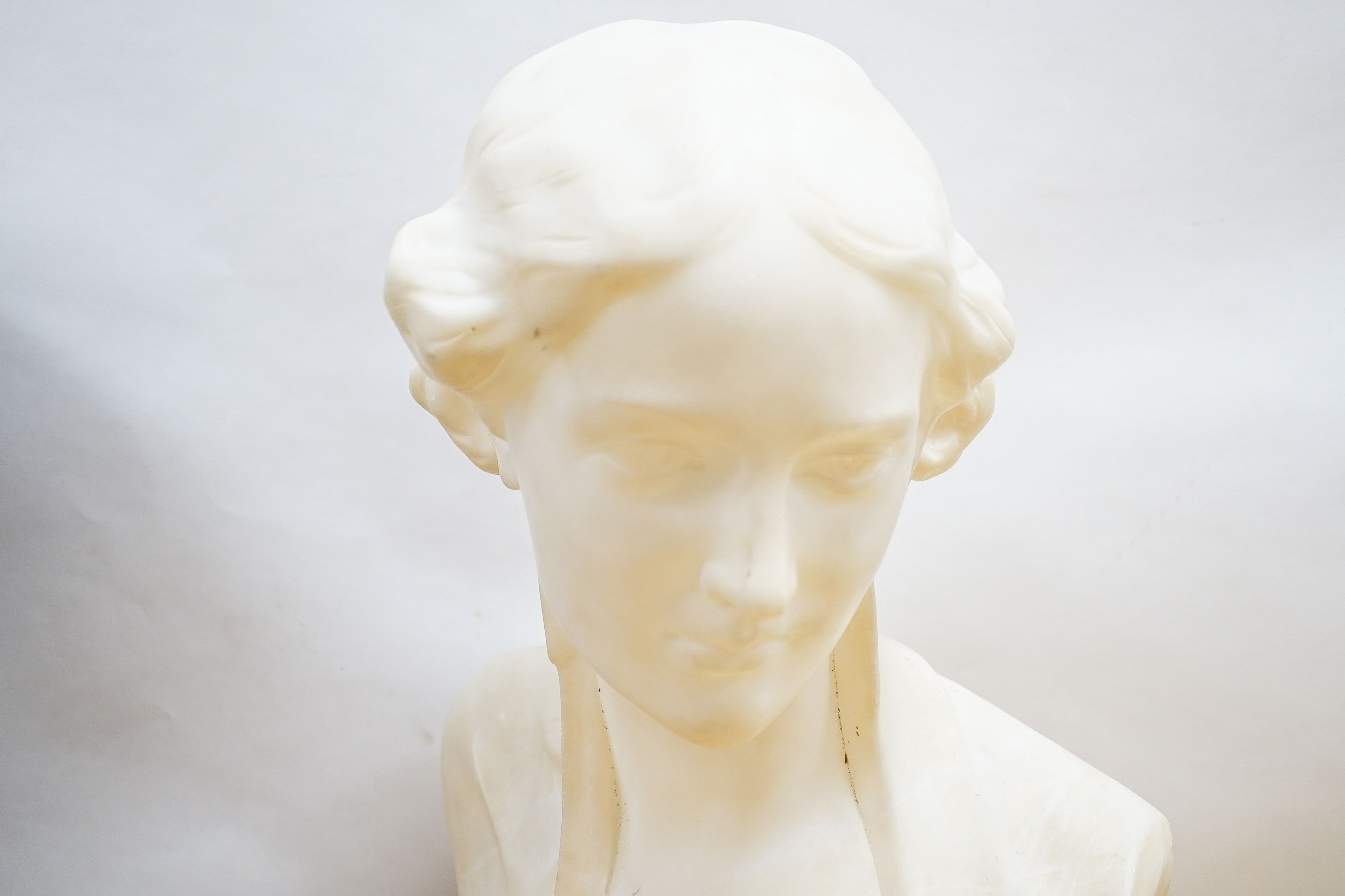 Valmore Gemignani, Italian 1879-1958, a carved alabaster bust of a lady, signed, 38cm